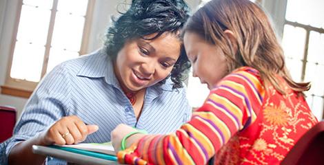 Teacher helping a student