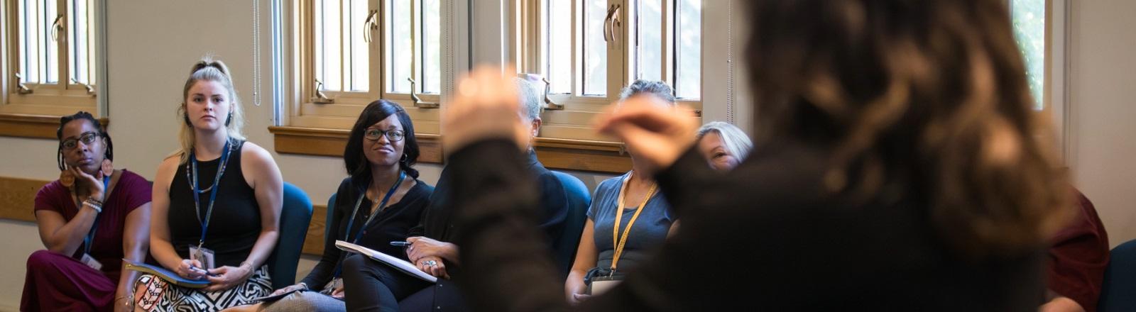 A diverse group of individuals communicating in sign language