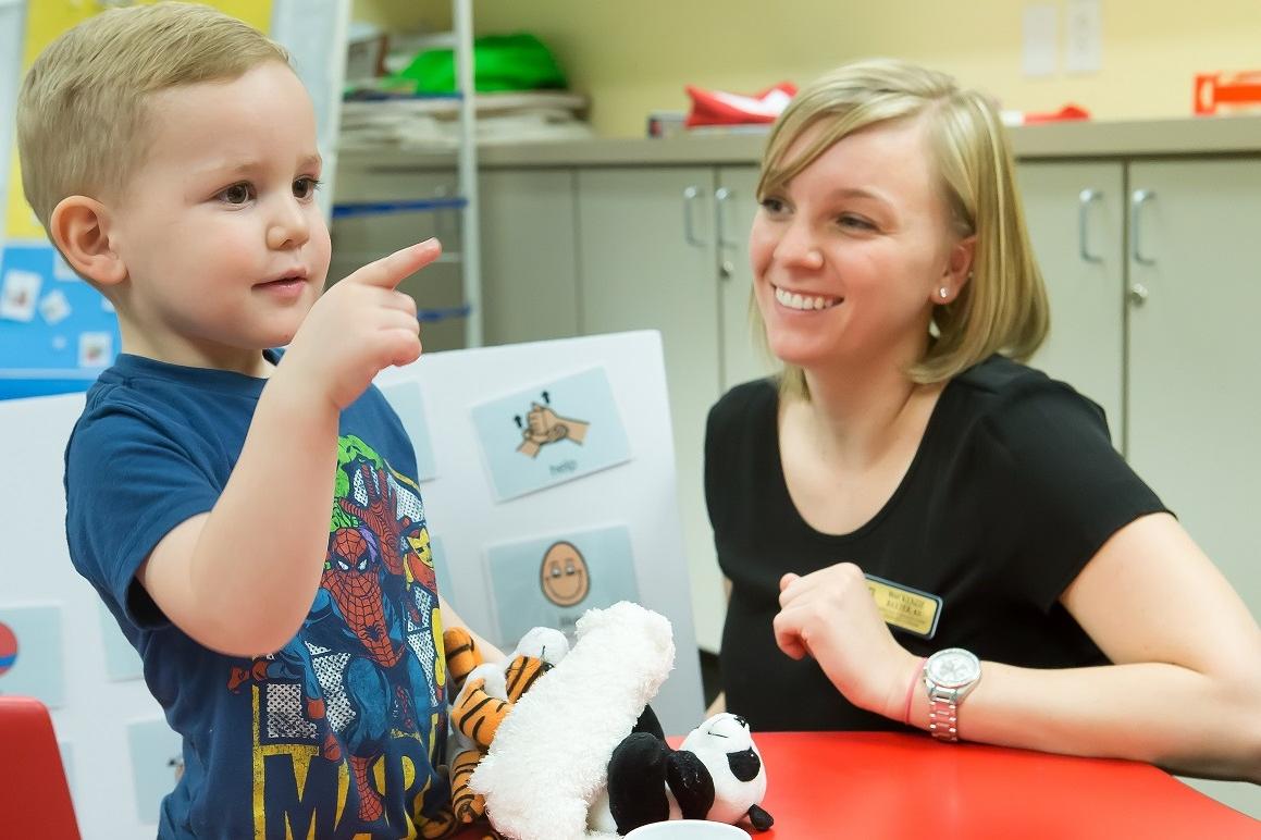 Interpreter interacting with preschool student