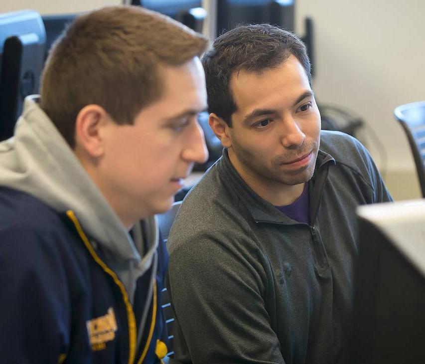 Two students at a computer